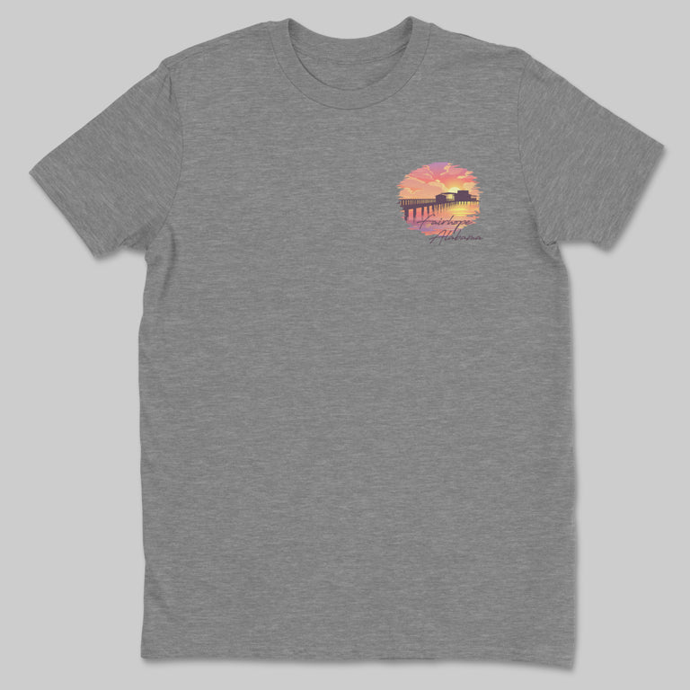 Gray "Fairhope Sunset - Tee" featuring a small graphic on the upper left with a sunset, Fairhope Pier, and the text "Sunset at the Pier.